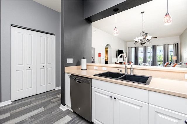 kitchen with pendant lighting, dishwasher, dark wood-type flooring, sink, and white cabinetry