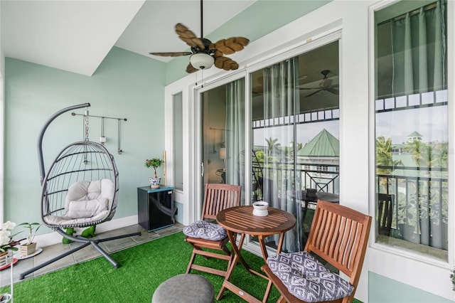 balcony featuring ceiling fan