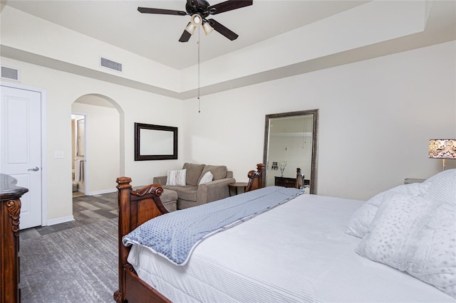 bedroom featuring ceiling fan and dark hardwood / wood-style floors