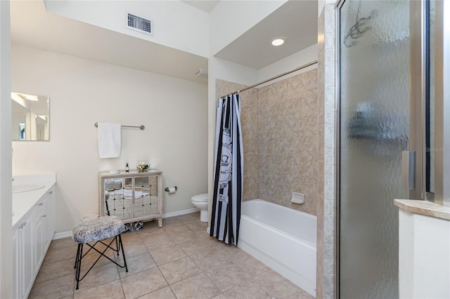 bathroom featuring tile patterned floors, vanity, and toilet