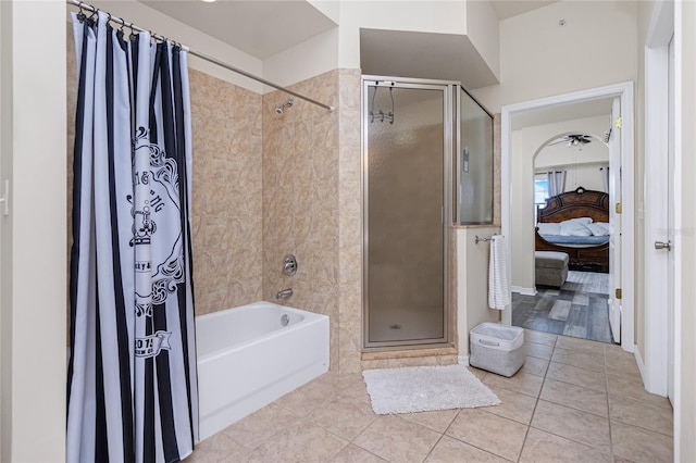 bathroom featuring tile patterned floors and separate shower and tub