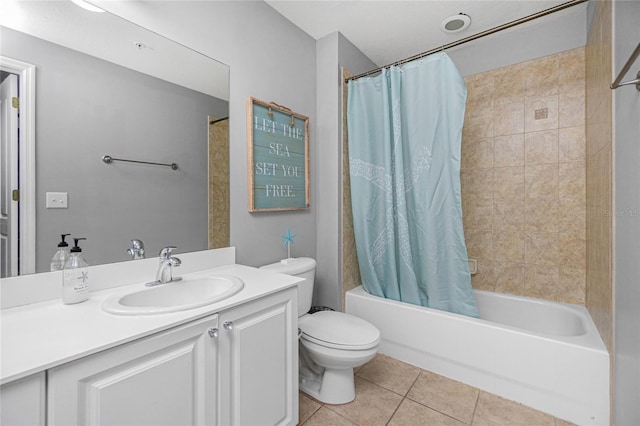 full bathroom featuring tile patterned floors, vanity, shower / bath combination with curtain, and toilet