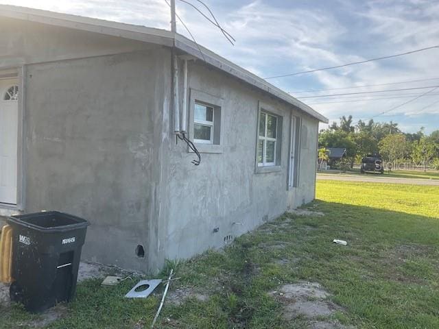 view of property exterior featuring a yard