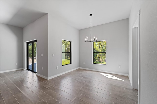 interior space with an inviting chandelier and dark hardwood / wood-style floors