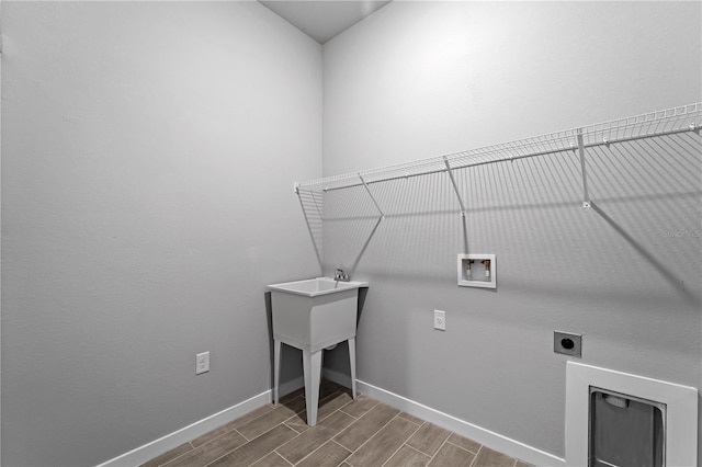 laundry area featuring hookup for an electric dryer, wood-type flooring, and washer hookup