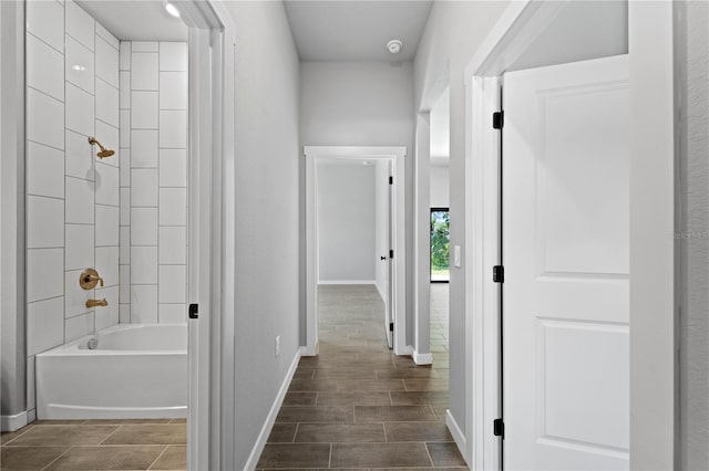 corridor with dark wood-type flooring