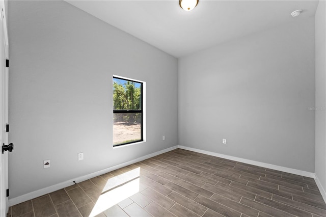 spare room featuring dark hardwood / wood-style floors