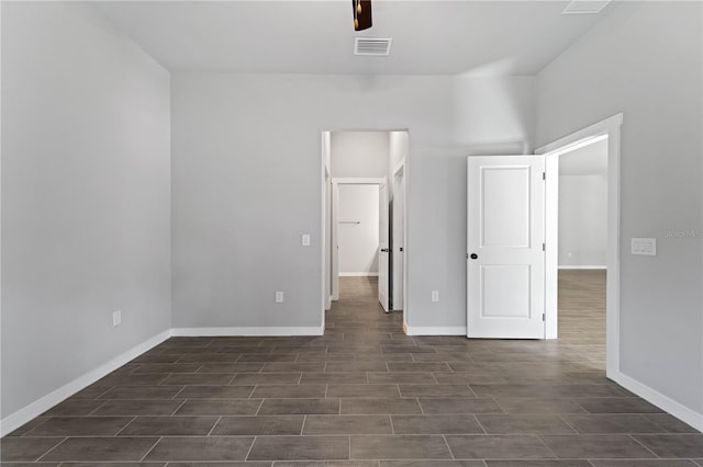 unfurnished bedroom with dark wood-type flooring and ceiling fan