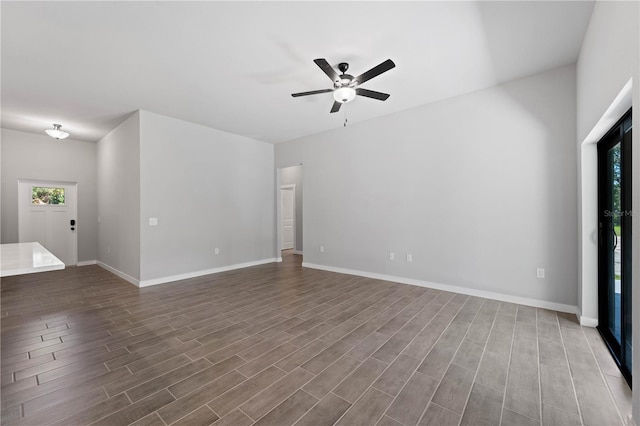 unfurnished living room featuring ceiling fan and wood-type flooring