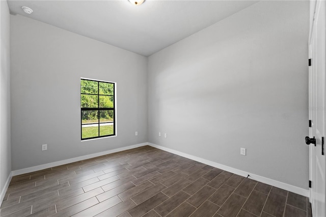 empty room featuring dark hardwood / wood-style floors