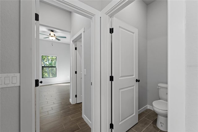 bathroom featuring toilet and ceiling fan