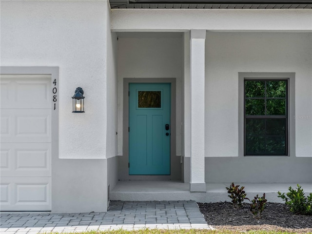 entrance to property featuring a garage