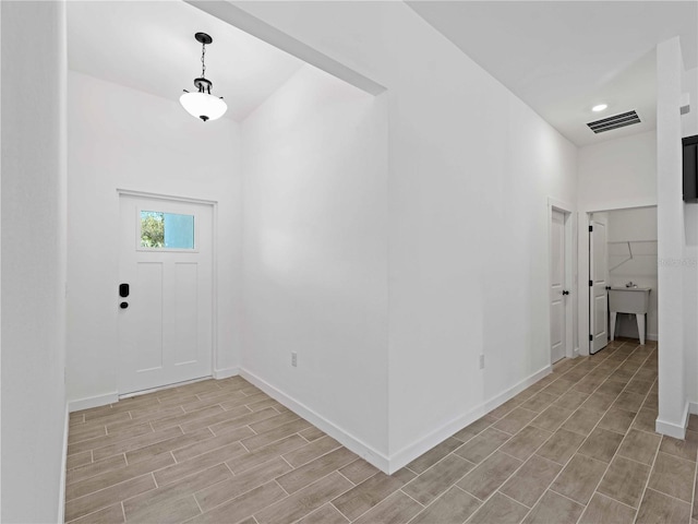 entrance foyer with light hardwood / wood-style flooring