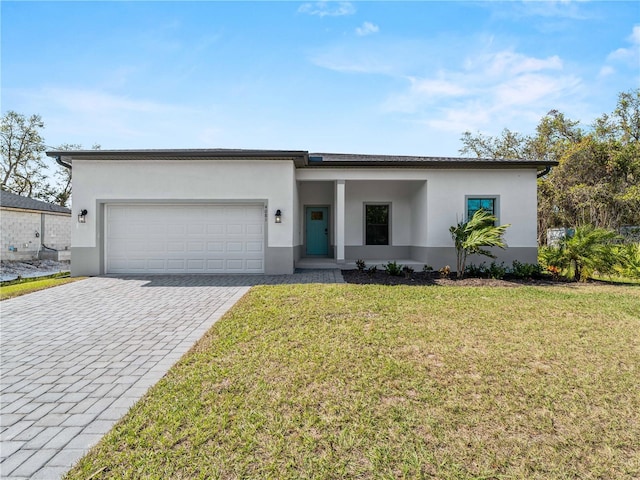 view of front facade featuring a front yard and a garage