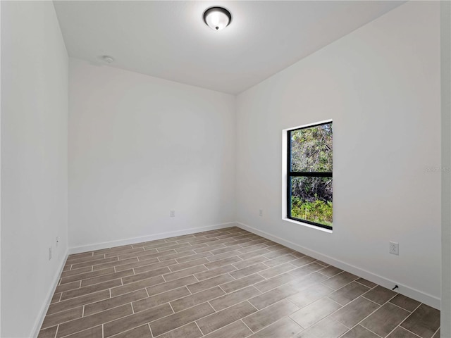 empty room with light hardwood / wood-style flooring