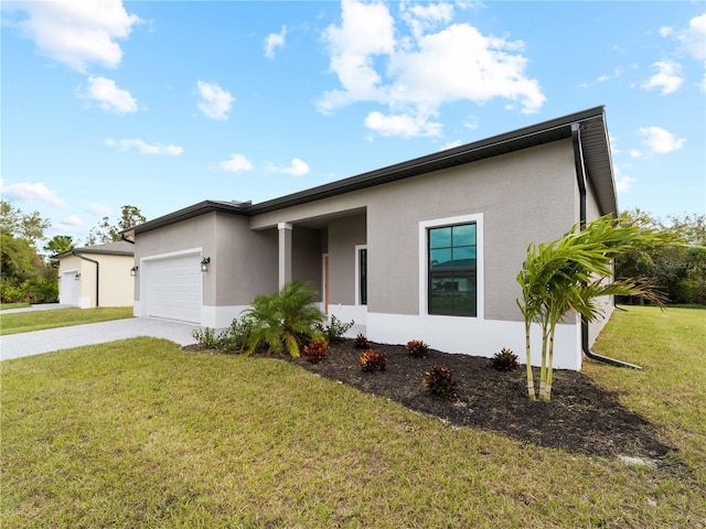 view of front of property featuring a garage and a front yard