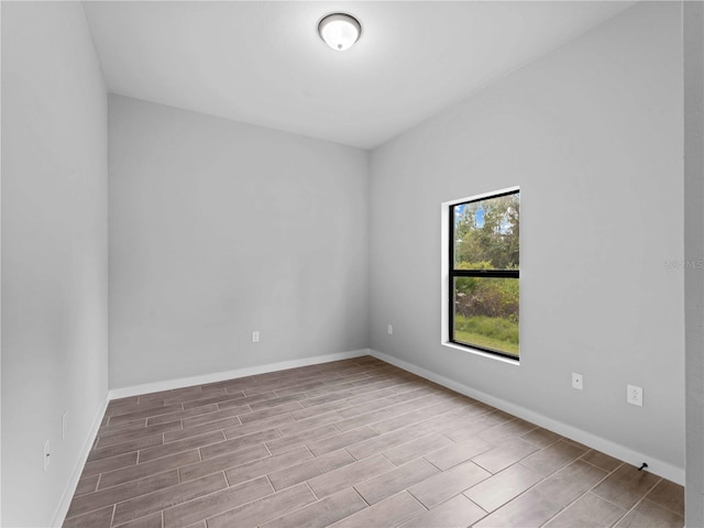 empty room with light hardwood / wood-style flooring