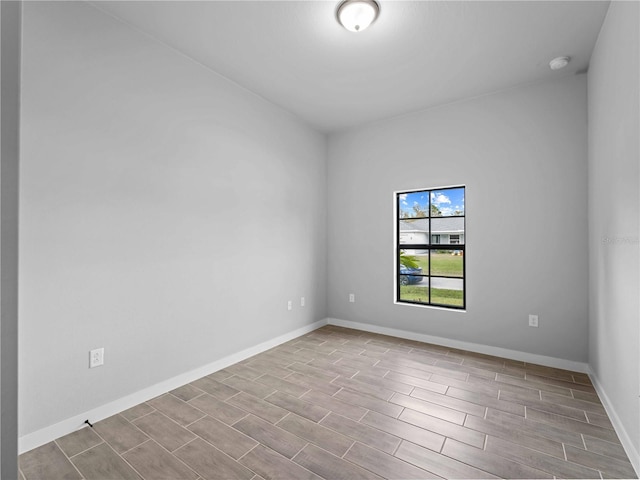 spare room with light hardwood / wood-style flooring