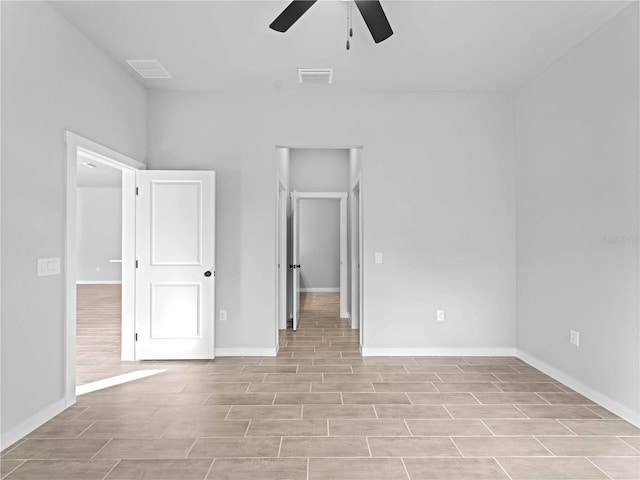 unfurnished bedroom featuring ceiling fan and light wood-type flooring