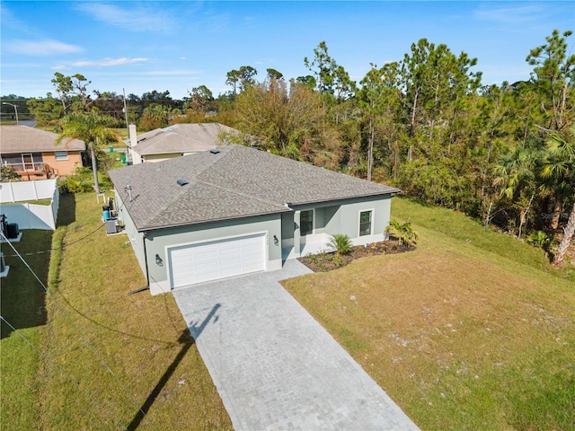 view of front of house featuring a garage and a front yard