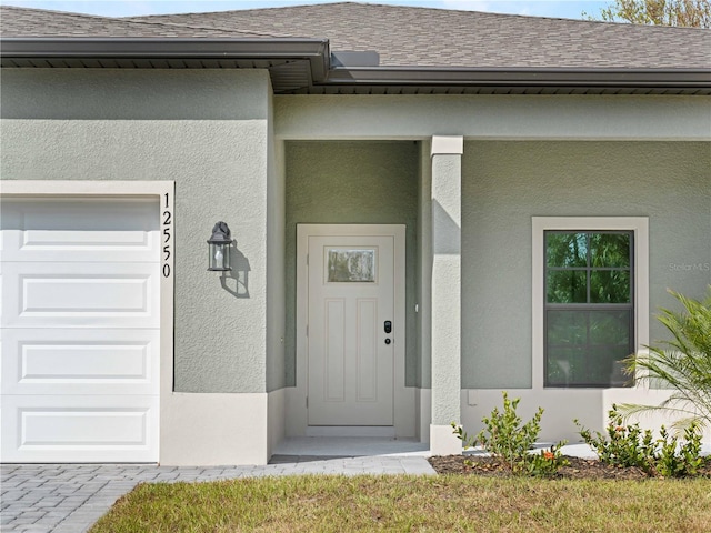 entrance to property featuring a garage