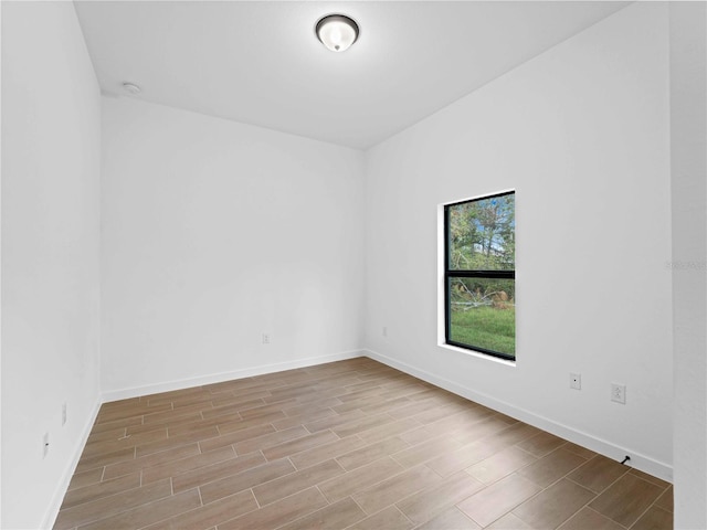 spare room with light wood-type flooring