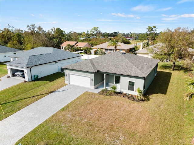 view of front facade with a garage and a front yard