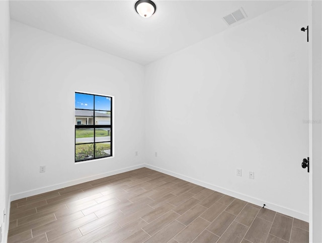 unfurnished room featuring light hardwood / wood-style flooring