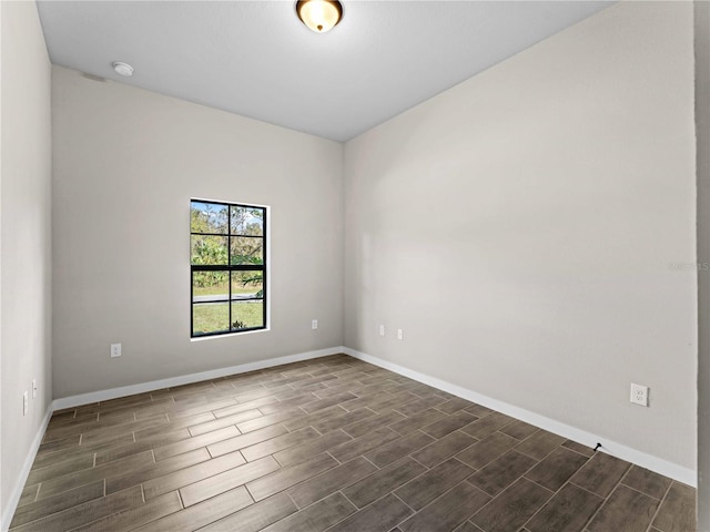 spare room featuring dark hardwood / wood-style flooring