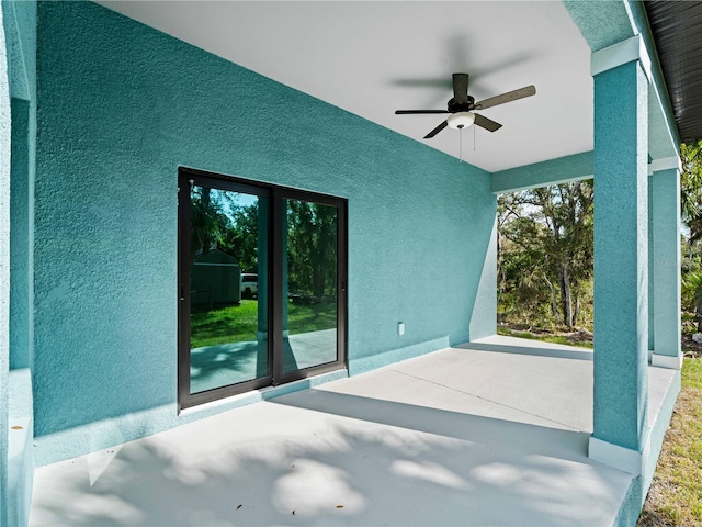 view of patio featuring ceiling fan