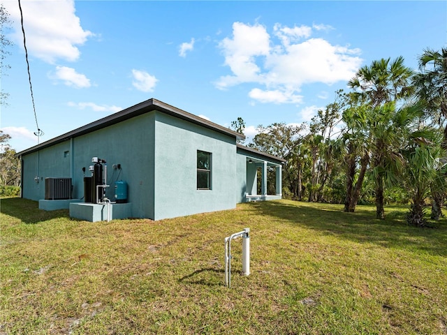 view of property exterior featuring a lawn