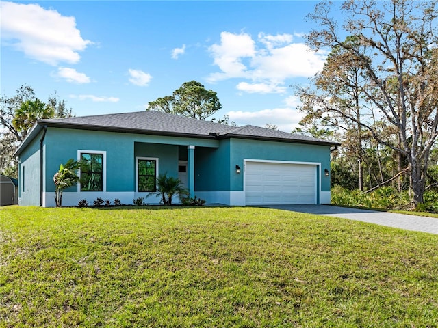 ranch-style house featuring a front lawn and a garage