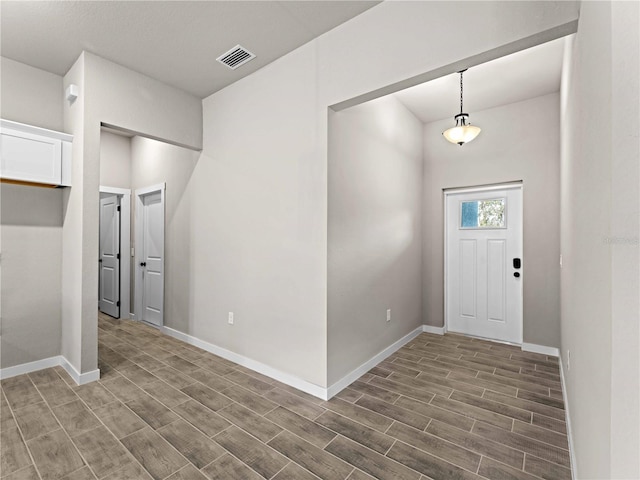 foyer with dark wood-type flooring