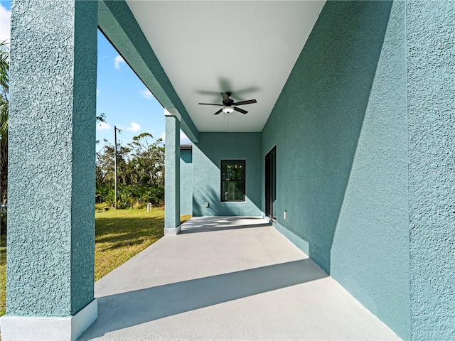 view of patio featuring ceiling fan