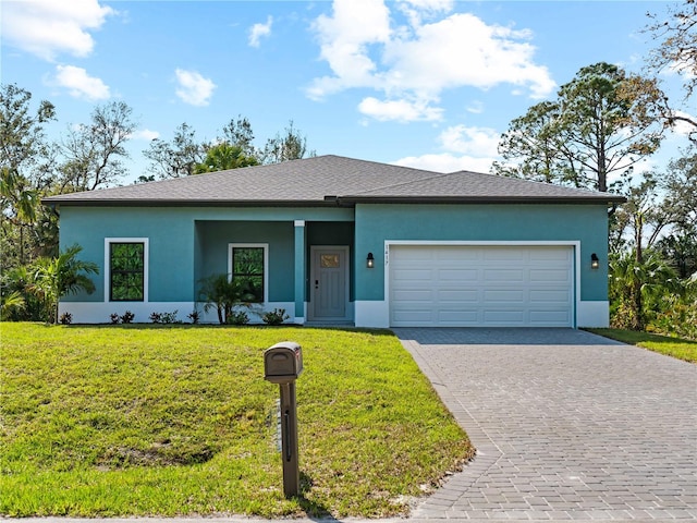 single story home with a front yard and a garage