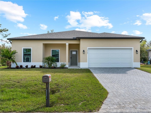 view of front of property featuring a garage and a front yard