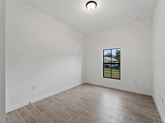 spare room featuring light hardwood / wood-style flooring