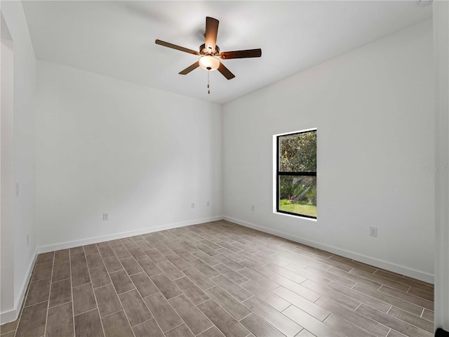 spare room featuring light hardwood / wood-style floors and ceiling fan