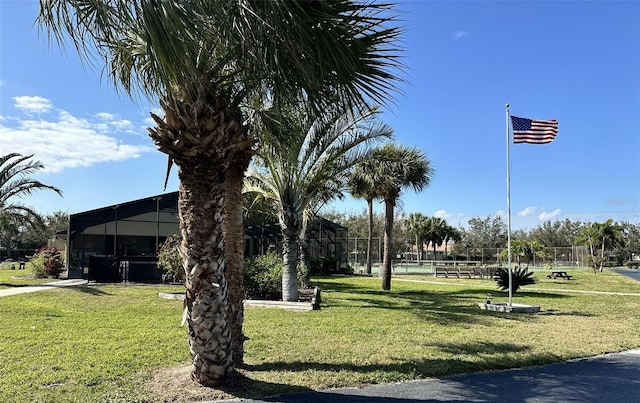 view of home's community with a lawn