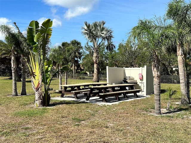 view of property's community with a lawn