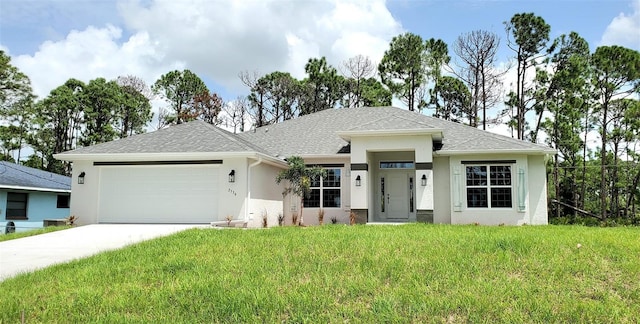 view of front of home featuring a front yard and a garage