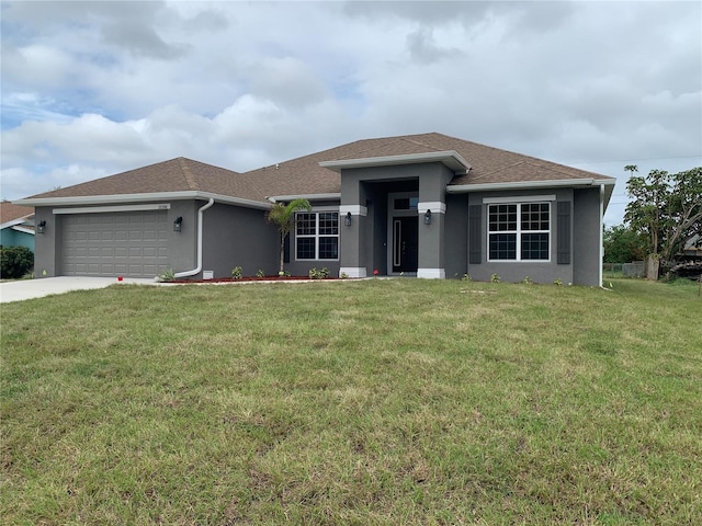 view of front of home with a garage and a front yard