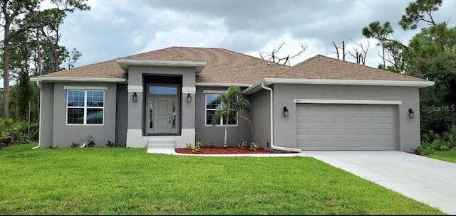 view of front facade with a front lawn and a garage