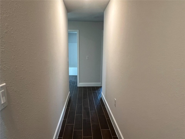 hall with dark hardwood / wood-style flooring