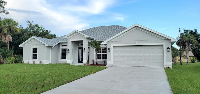 view of front of house featuring a garage and a front yard