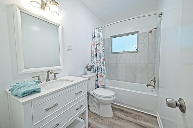 full bathroom featuring hardwood / wood-style floors, toilet, shower / bathtub combination with curtain, and vanity