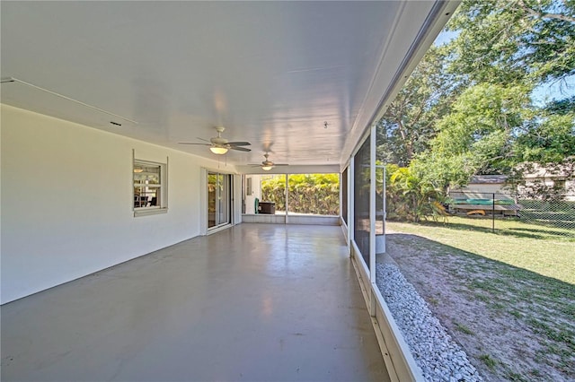 exterior space with ceiling fan