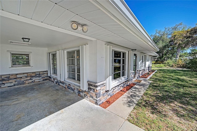 view of home's exterior featuring a patio and a lawn