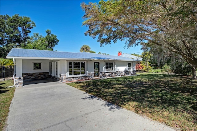 ranch-style home with a front yard