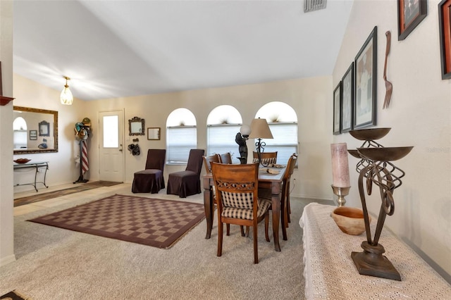 dining space with light colored carpet